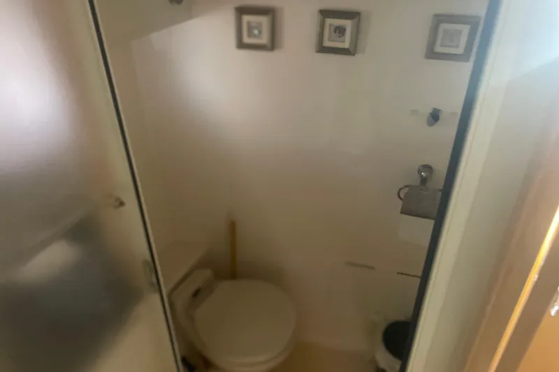 Slide: The Image of Bathroom interior of 2000 Carver 456 Aft Cabin Motor Yacht, featuring compact design. - 20