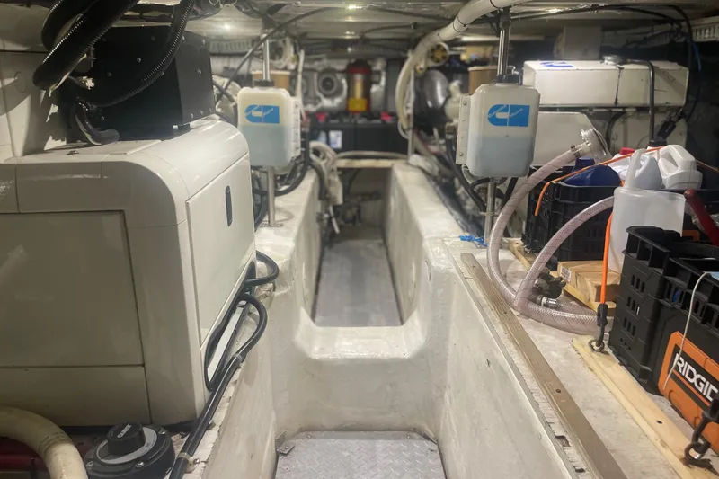 Slide: The Image of Engine room of 2000 Carver 456 Aft Cabin Motor Yacht, featuring equipment and storage. - 21