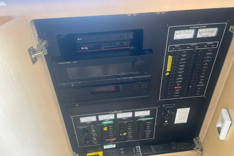 Slide: The Image of Control panel inside 2000 Carver 456 Aft Cabin Motor Yacht, featuring electronic and audio equipment. - 22