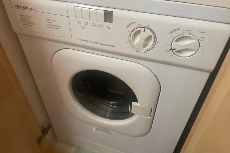 Slide: The Image of Washer and dryer unit on 2000 Carver 456 Aft Cabin Motor Yacht. - 24