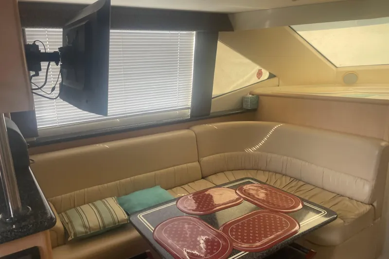 Slide: The Image of Interior of 2000 Carver 456 Aft Cabin Motor Yacht with cozy seating and TV. - 6
