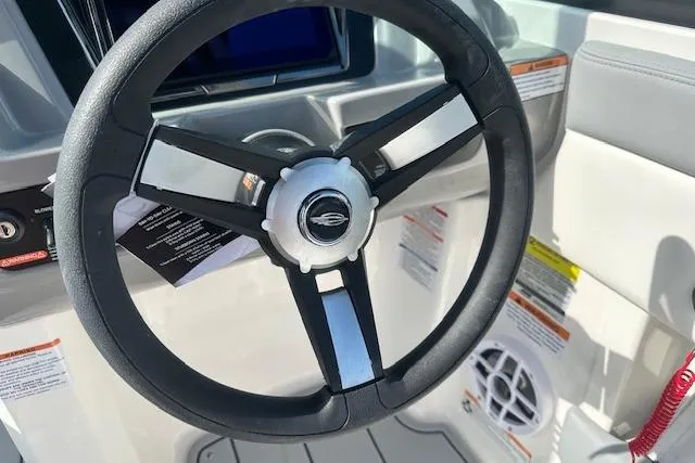 Slide: The Image of Steering wheel of 2026 Chaparral 21 SSi boat, featuring modern design and controls. - 10