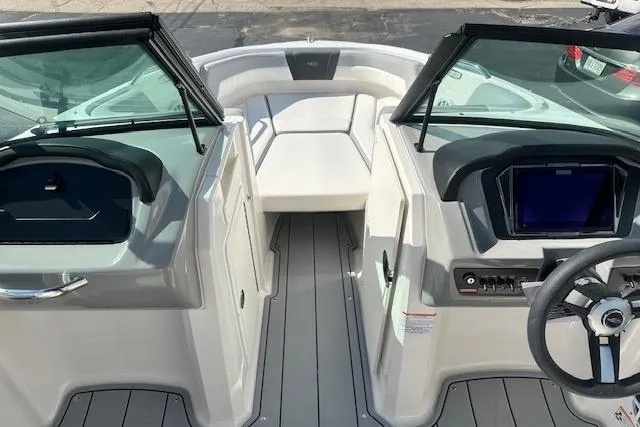 Slide: The Image of 2026 Chaparral 21 SSi boat interior with modern dashboard and seating. - 14