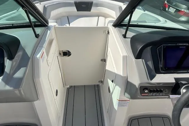 Slide: The Image of Interior view of 2026 Chaparral 21 SSi boat, featuring sleek design and modern controls. - 15