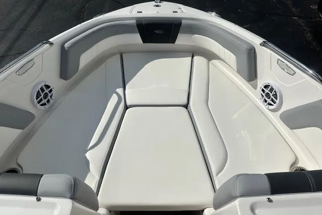 Slide: The Image of 2026 Chaparral 21 SSi boat interior with white cushioned seating and speakers. - 17