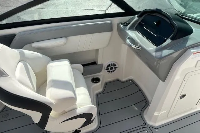 Slide: The Image of Interior of 2026 Chaparral 21 SSi boat with white seating and modern dashboard. - 23