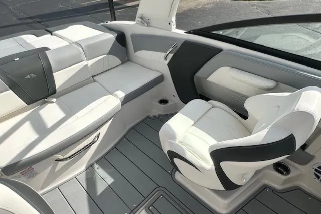 Slide: The Image of 2026 Chaparral 21 SSi boat interior with white and gray seating. - 28