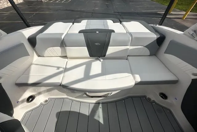 Slide: The Image of 2026 Chaparral 21 SSi boat interior with white and gray seating, modern design. - 30