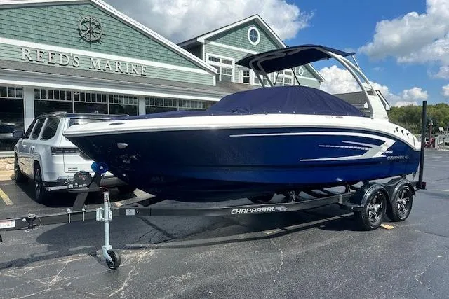 Slide: The Image of 2026 Chaparral 21 SSi boat on trailer outside Reed's Marine dealership. - 35
