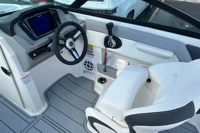 Slide: The Image of 2026 Chaparral 21 SSi boat interior with steering wheel and control panel. - 9