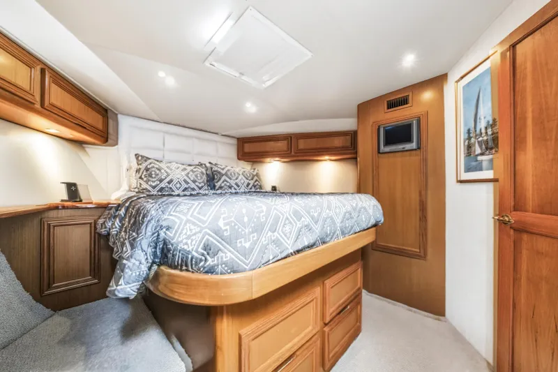 Slide: The Image of Luxurious cabin interior of 2002 Cavileer 48 Flybridge Sportfish yacht with elegant bedding. - 15