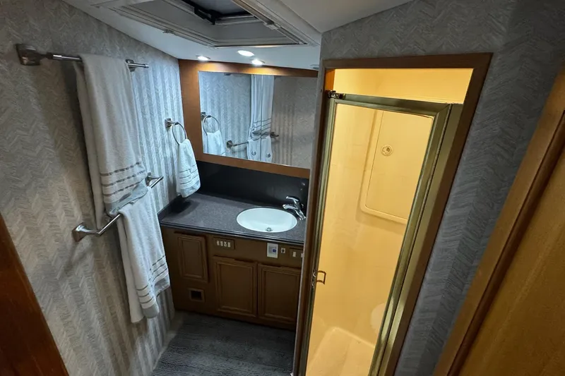 Slide: The Image of Bathroom interior of 2002 Cavileer 48 Flybridge Sportfish yacht with sink and shower. - 19