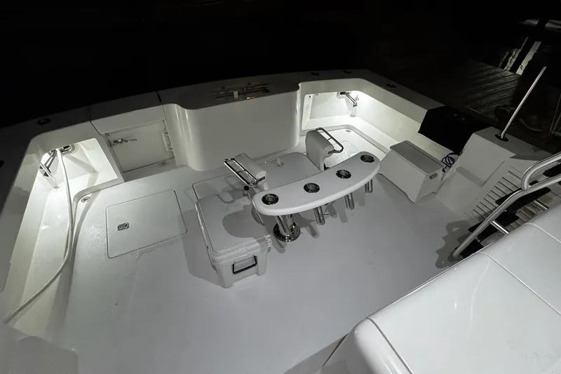 Slide: The Image of 2002 Cavileer 48 Flybridge Sportfish boat deck with illuminated fishing area. - 23