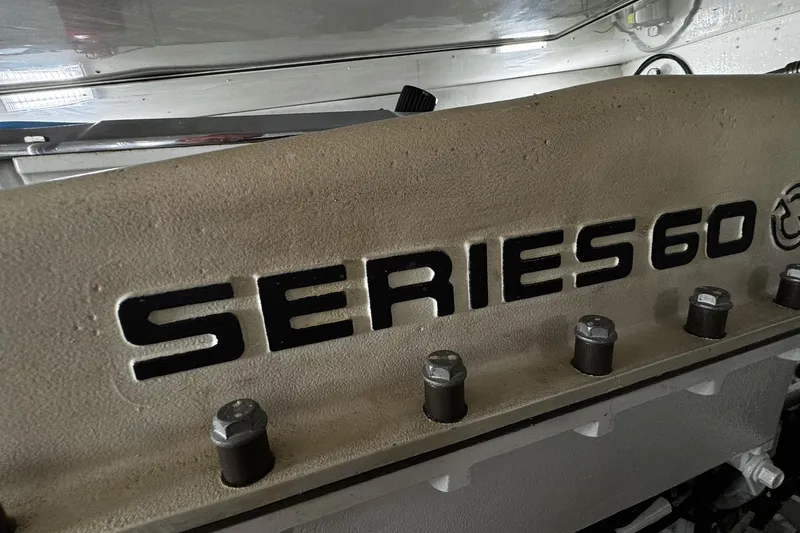 Slide: The Image of Engine detail of 2002 Cavileer 48 Flybridge Sportfish, featuring Series 60 branding. - 27