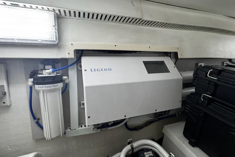 Slide: The Image of Engine room of 2002 Cavileer 48 Flybridge Sportfish with water filtration system. - 45