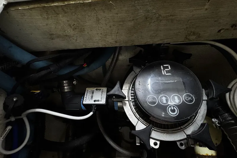 Slide: The Image of Engine room of 2002 Cavileer 48 Flybridge Sportfish with electronic control panel. - 50