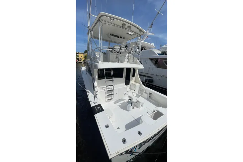 Slide: The Image of 2002 Cavileer 48 Flybridge Sportfish yacht with spacious deck and flybridge. - 58