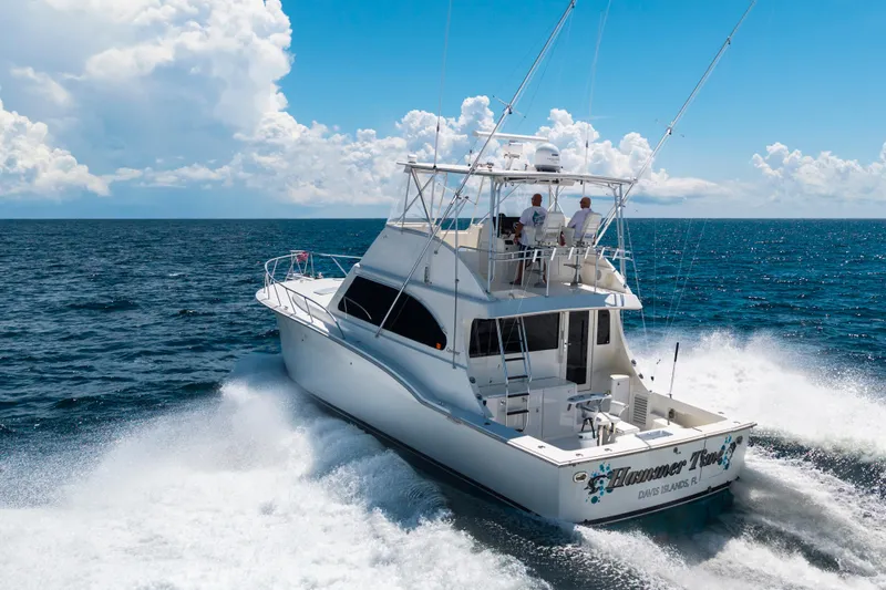 Slide: The Image of 2002 Cavileer 48 Flybridge Sportfish cruising on open ocean under clear skies. - 66