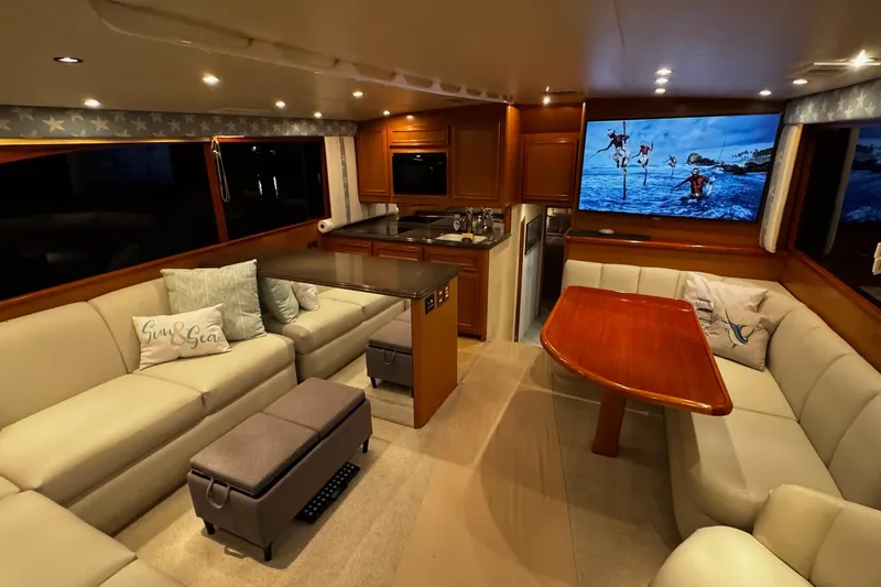 Slide: The Image of Luxurious interior of 2002 Cavileer 48 Flybridge Sportfish yacht with plush seating and modern amenities. - 7