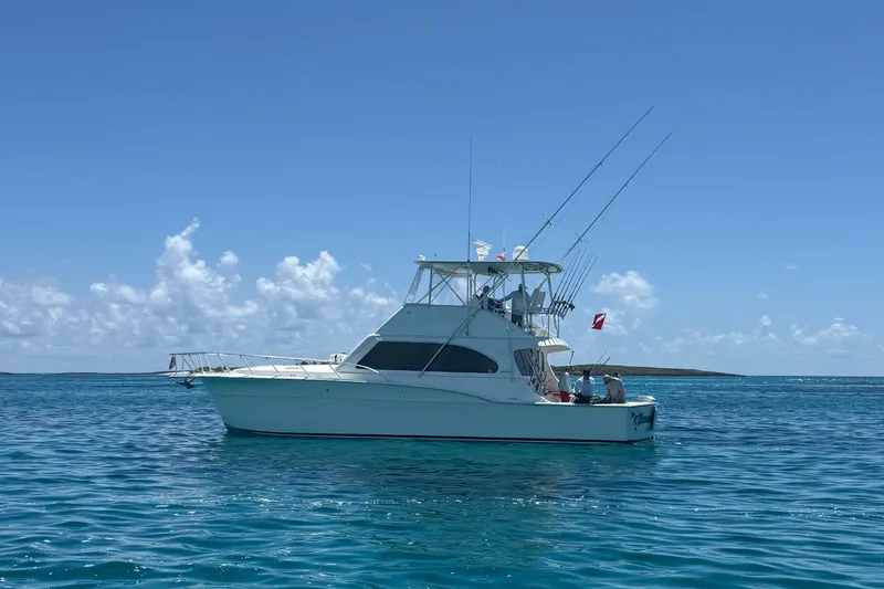 Slide: The Image of 2002 Cavileer 48 Flybridge Sportfish boat on clear blue ocean under sunny sky. - 73