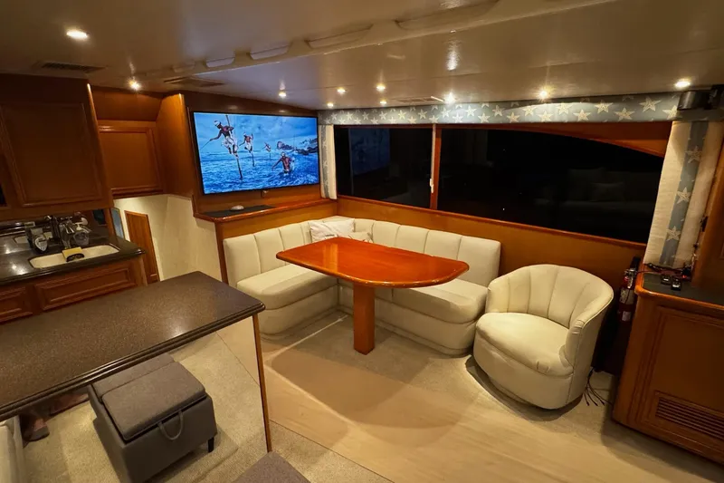 Slide: The Image of Luxurious interior of 2002 Cavileer 48 Flybridge Sportfish with cozy seating and modern amenities. - 8