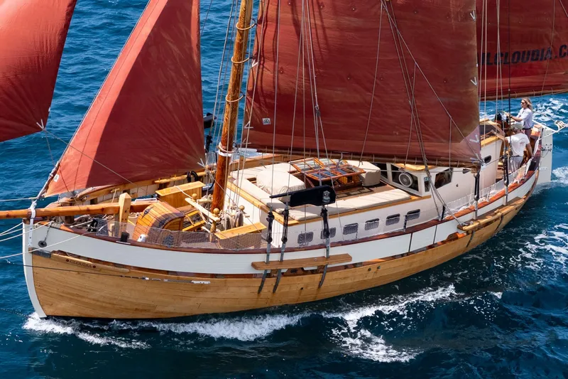 Slide: The Image of 1938 Norwegian Double Ended Ketch sailing on blue ocean waters. - 22