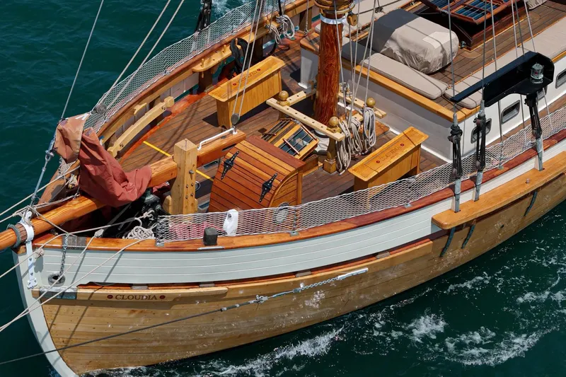 Slide: The Image of 1938 Norwegian Double Ended Ketch sailing on blue water, showcasing wooden craftsmanship. - 27