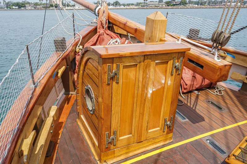 Slide: The Image of Wooden deck of 1938 Norwegian Double Ended Ketch with polished cabin and nautical details. - 30
