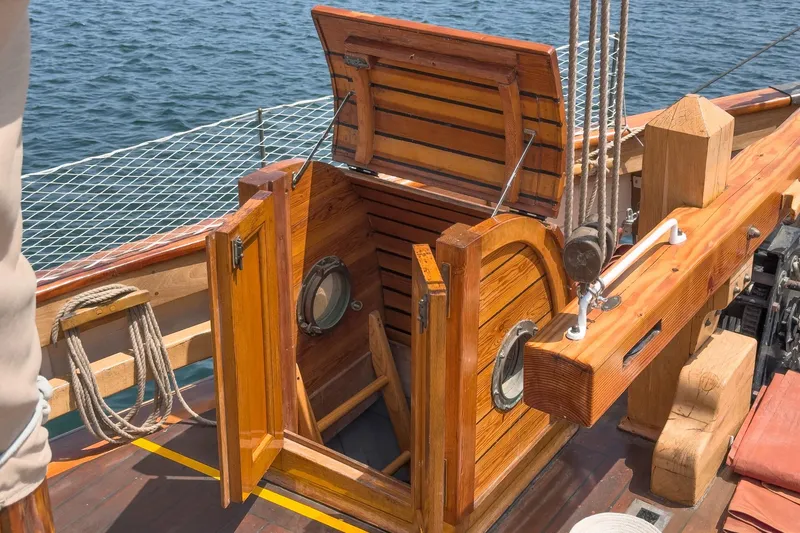 Slide: The Image of 1938 Norwegian Double Ended Ketch with open wooden hatch on deck. - 32