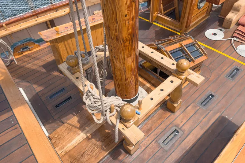 Slide: The Image of Wooden deck of 1938 Norwegian Double Ended Ketch with mast and ropes. - 33