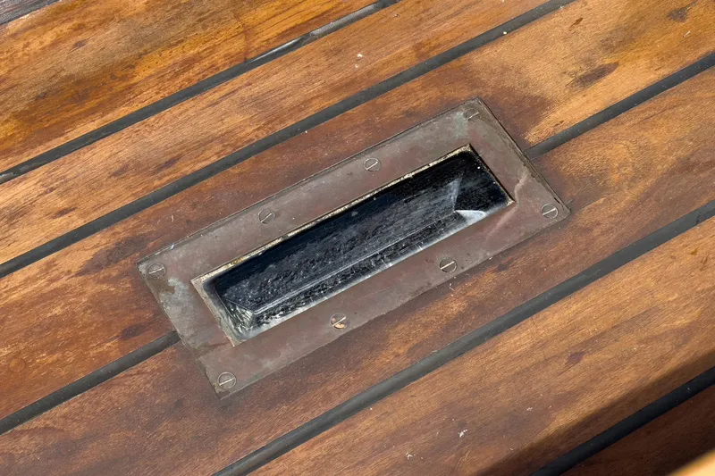 Slide: The Image of Wooden deck detail of 1938 Norwegian Double Ended Ketch with metal hatch. - 34