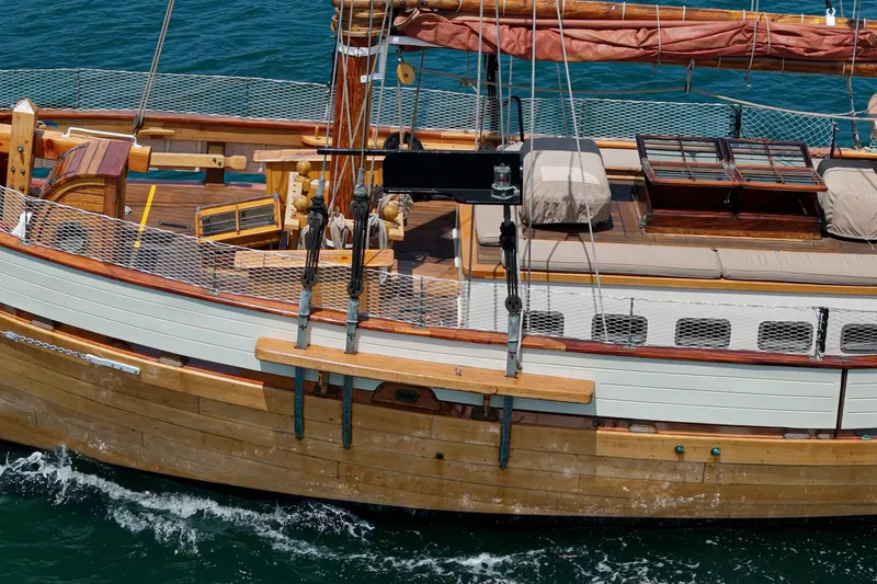 Slide: The Image of 1938 Norwegian Double Ended Ketch sailing on blue ocean waters. - 35