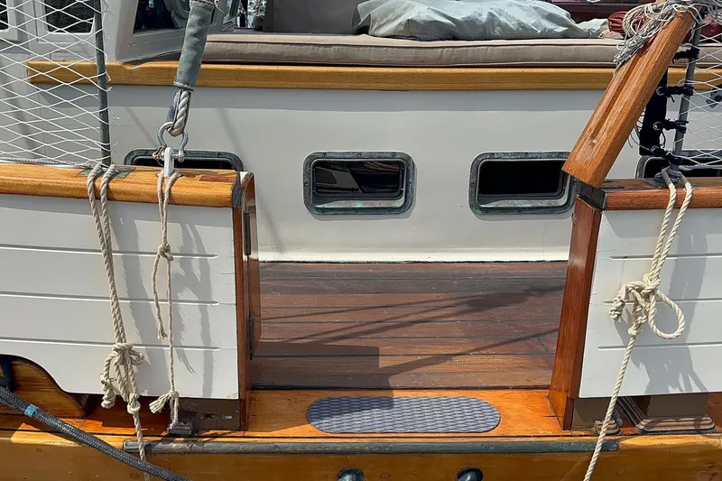 Slide: The Image of 1938 Norwegian Double Ended Ketch deck with ropes and wooden details. - 40