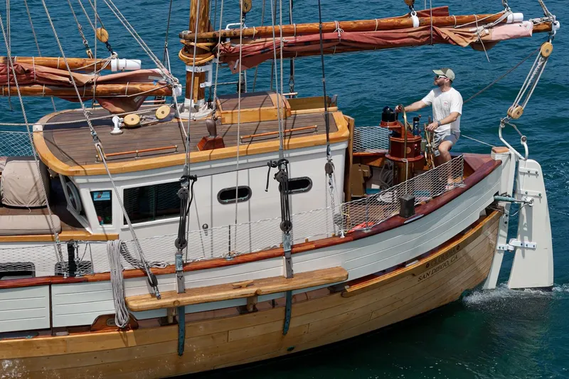 Slide: The Image of 1938 Norwegian Double Ended Ketch sailing on blue ocean waters. - 42