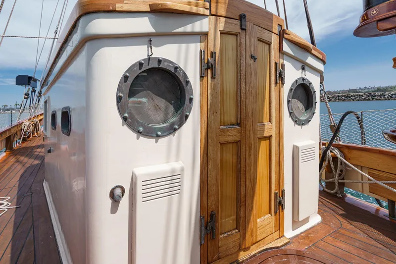 Slide: The Image of Wooden cabin and portholes on a 1938 Norwegian Double Ended Ketch sailboat. - 50