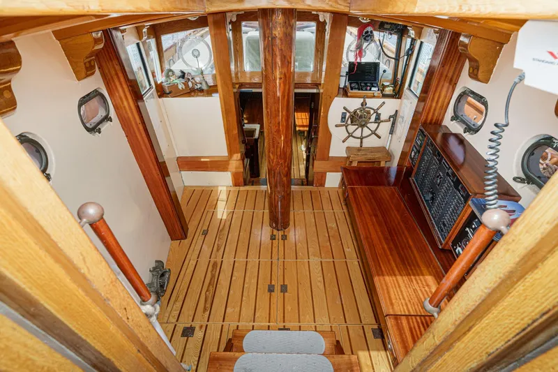 Slide: The Image of Interior of a 1938 Norwegian Double Ended Ketch with wooden finishes and nautical decor. - 52