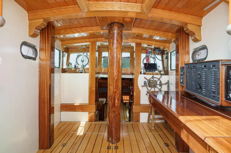 Slide: The Image of Interior of 1938 Norwegian Double Ended Ketch with wooden helm and navigation equipment. - 53