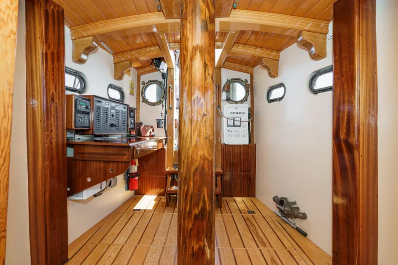 Slide: The Image of Interior of 1938 Norwegian Double Ended Ketch with wooden finishes and navigation equipment. - 54