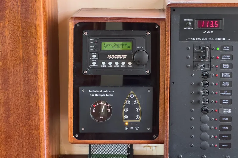 Slide: The Image of Control panel of a 1938 Norwegian Double Ended Ketch, featuring tank-level indicators. - 56