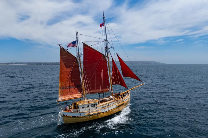 Slide: The Image of Vintage 1938 Norwegian Double Ended Ketch sailing on open sea under clear skies. - 6