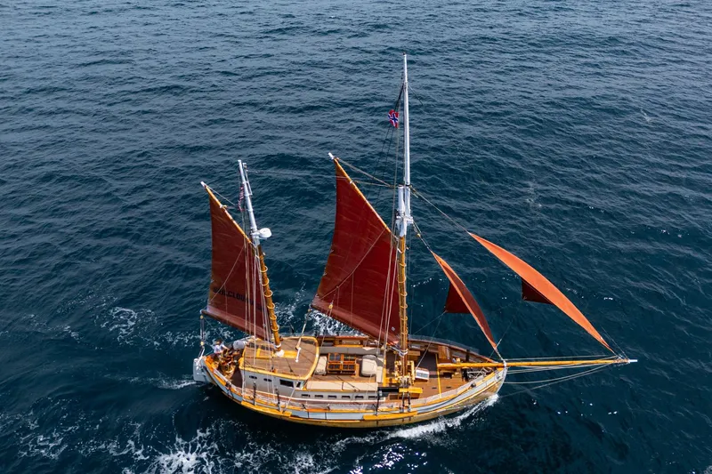 Slide: The Image of Aerial view of 1938 Norwegian Double Ended Ketch sailing on open sea. - 7