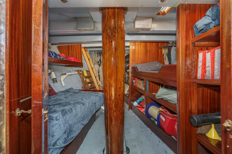 Slide: The Image of Interior of 1938 Norwegian Double Ended Ketch with wooden bunks and storage. - 77