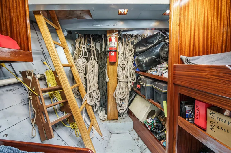 Slide: The Image of Interior of a 1938 Norwegian Double Ended Ketch with ropes and storage shelves. - 83