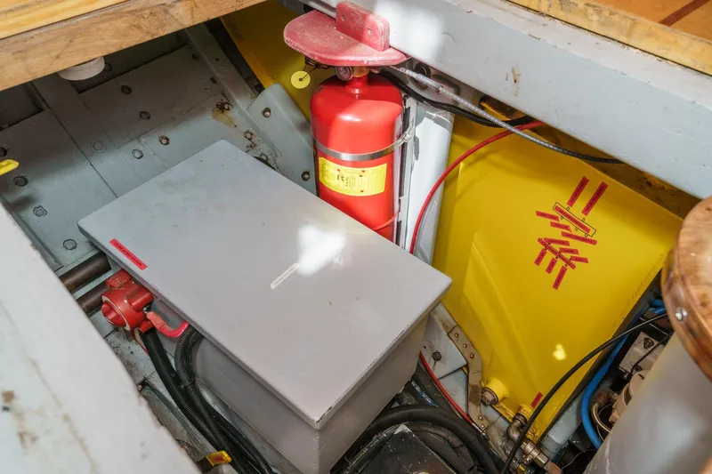 Slide: The Image of Engine room of 1938 Norwegian Double Ended Ketch with fire extinguisher and equipment. - 87