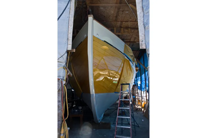 Slide: The Image of Vintage 1938 Norwegian Double Ended Ketch under restoration in a workshop. - 94