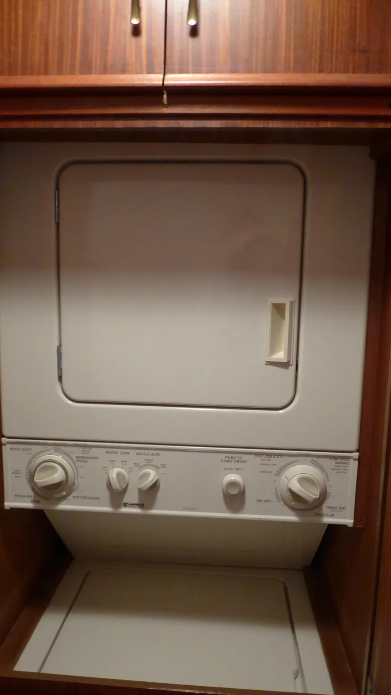 Slide: The Image of Stacked washer and dryer in 1985 Hatteras 56 Motor Yacht laundry area. - 23