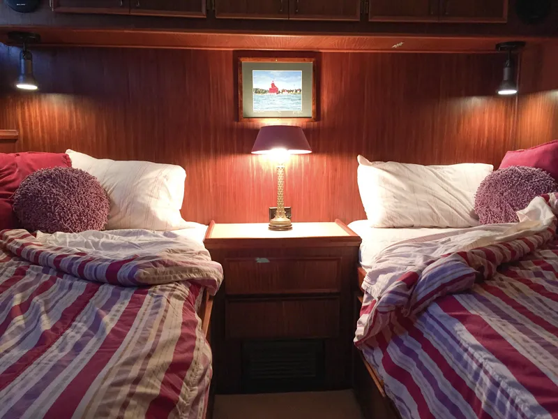 Slide: The Image of Twin beds in a cozy cabin of a 1985 Hatteras 56 Motor Yacht. - 24