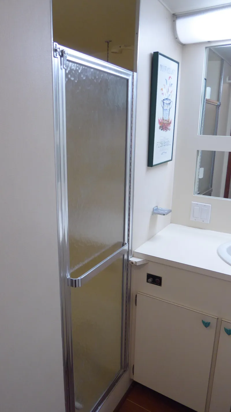 Slide: The Image of Bathroom interior of 1985 Hatteras 56 Motor Yacht with shower and vanity. - 36