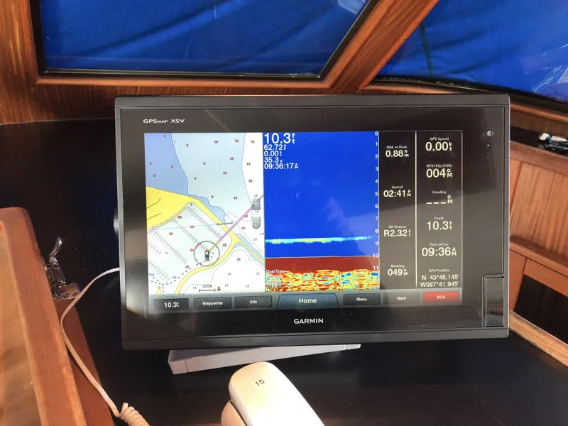 Slide: The Image of Garmin GPS display on 1985 Hatteras 56 Motor Yacht, showing navigation and sonar data. - 37
