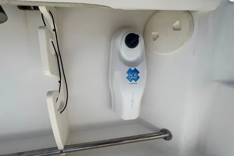 Slide: The Image of ACR Electronics device on 2004 Boston Whaler 305 Conquest boat interior. - 29